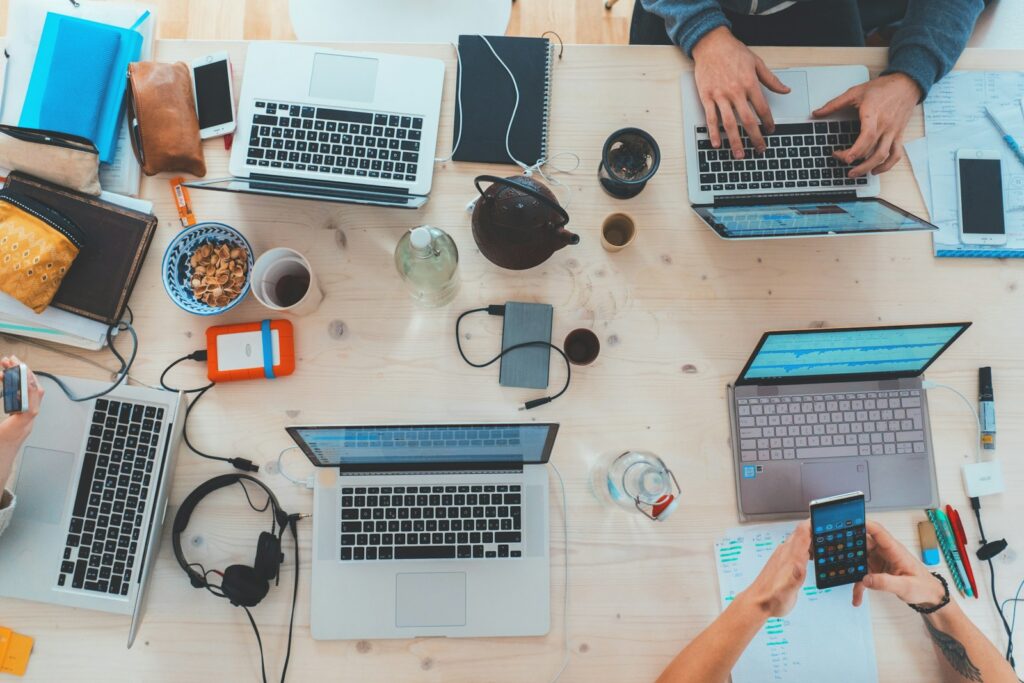 Laptop and notebook on a desk representing affiliate marketing and online work from home setup