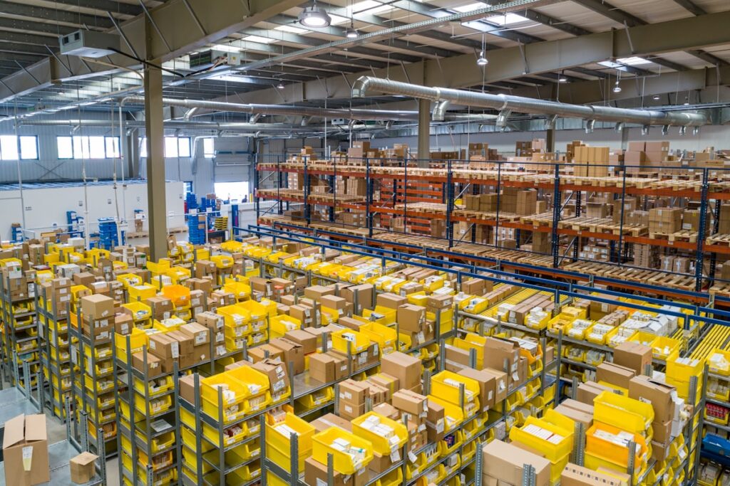 Warehouse shelves filled with cardboard boxes ready for Amazon FBA fulfillment