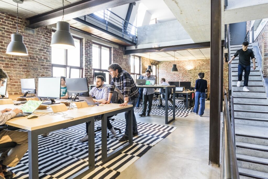 A modern workspace setup showing a laptop on a desk representing a freelance email marketing side hustle from home