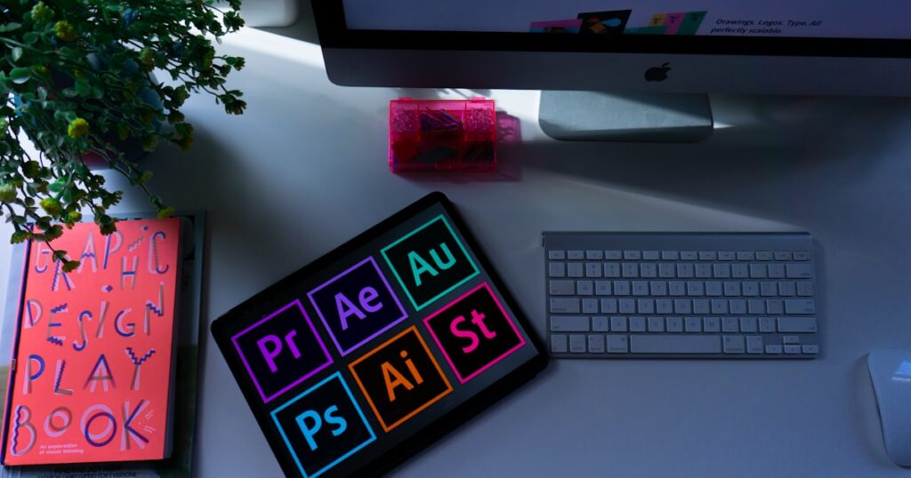 graphic design workspace with computer and creative tools