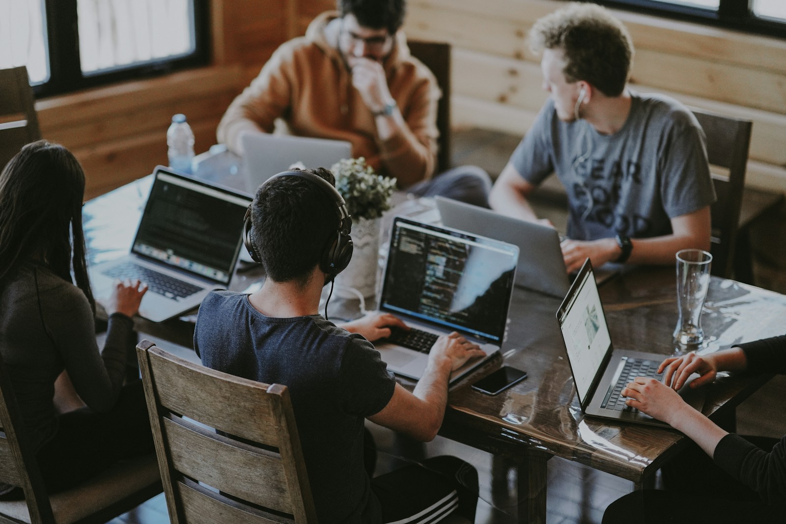 freelance web developer working on laptop with code on screen