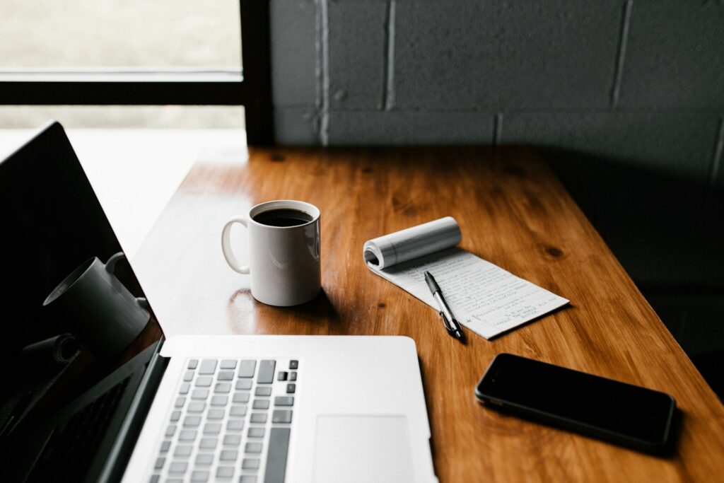 Laptop and coffee on desk workspace