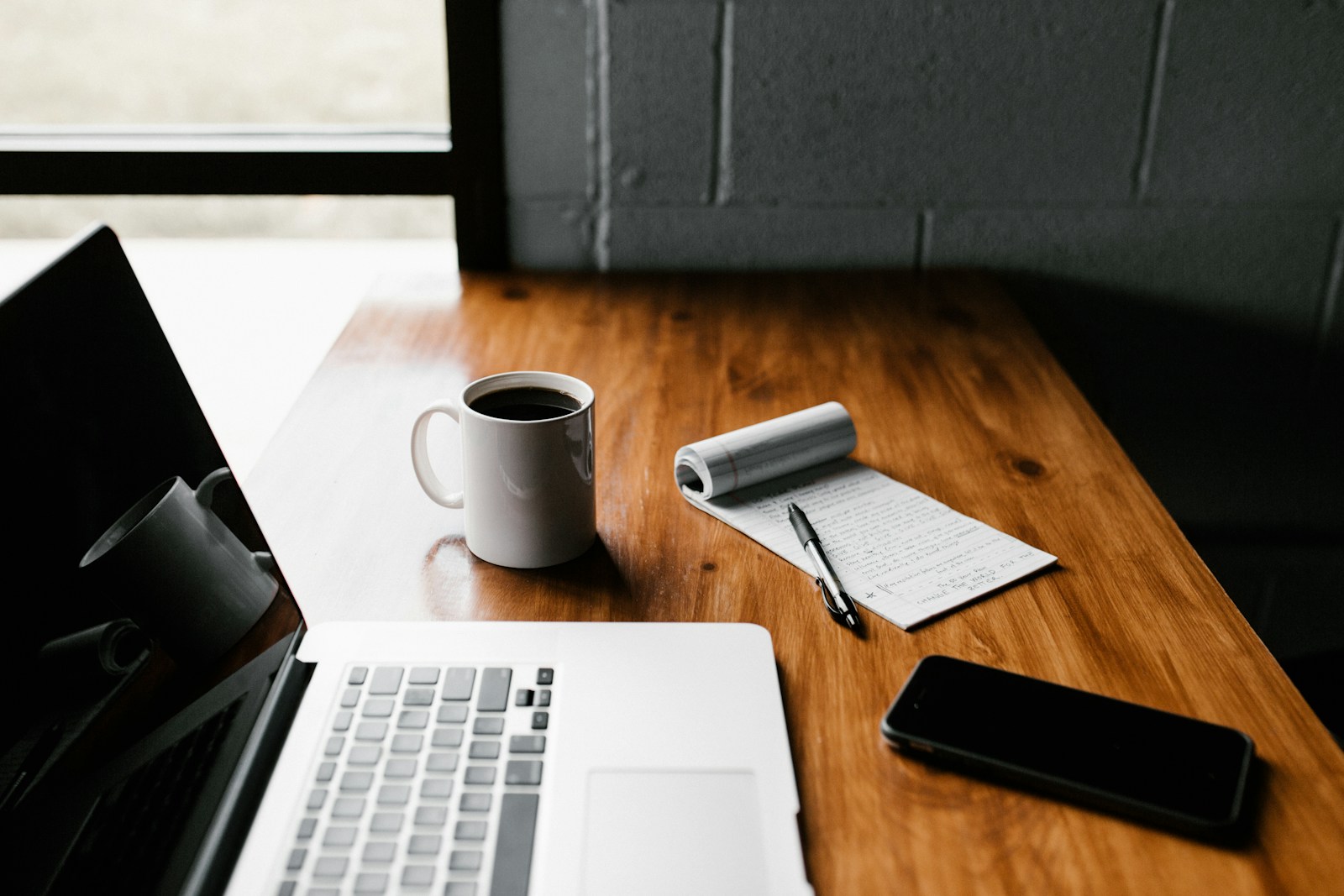 Laptop and coffee on desk workspace
