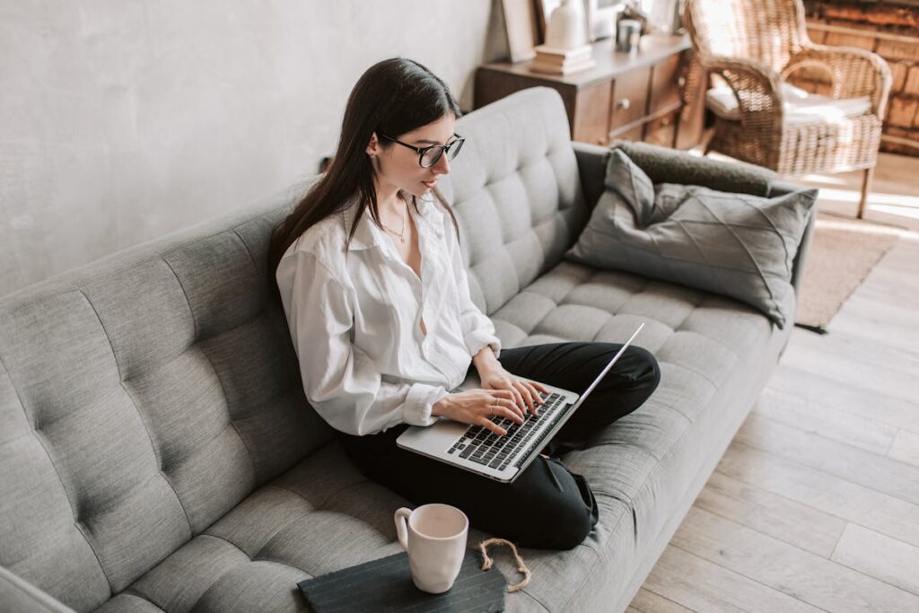 Laptop and notebook on a desk representing a freelance SEO consultant workspace