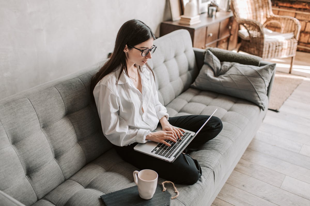 Laptop and notebook on a desk representing a freelance SEO consultant workspace